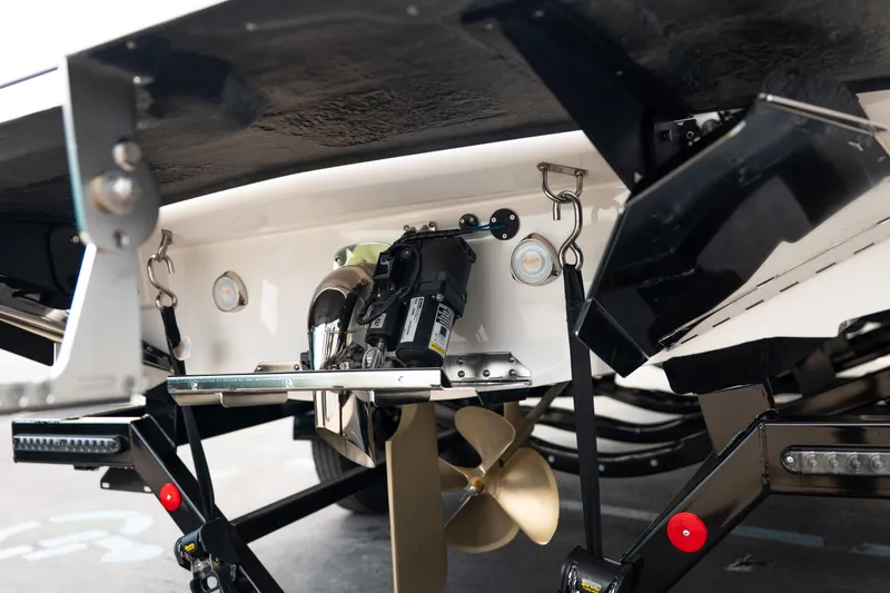 Slide: The Image of Underneath view of a 2026 MasterCraft NXT23 boat, showcasing propeller and mechanical components. - 7