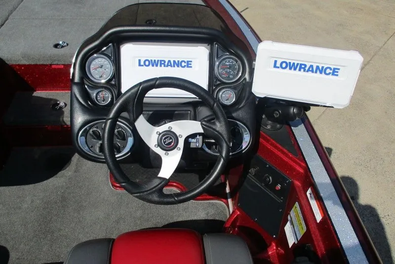Slide: The Image of 2014 Triton 18XS SC boat dashboard with Lowrance electronics and steering wheel. - 8