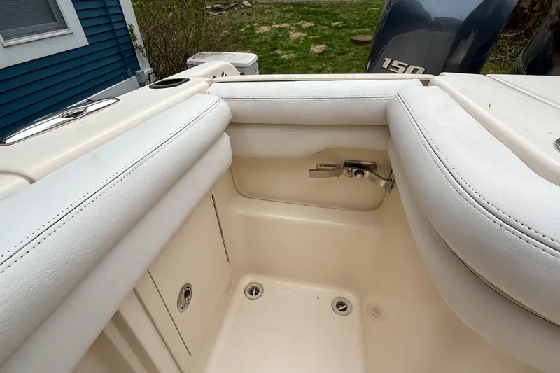 Slide: The Image of Interior view of a 2015 Grady-White Freedom 275 boat with cushioned seating. - 43