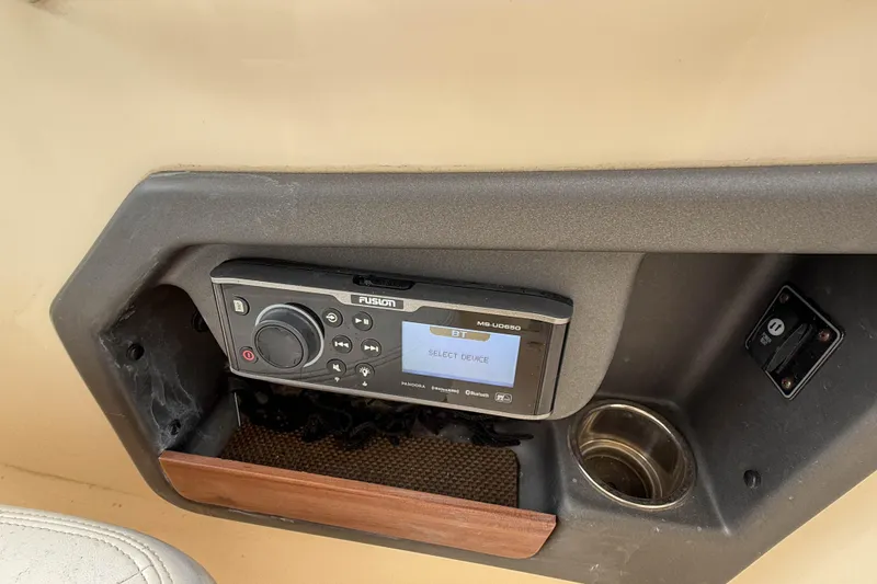 Slide: The Image of Fusion stereo system on 2015 Grady-White Freedom 275 boat dashboard. - 50