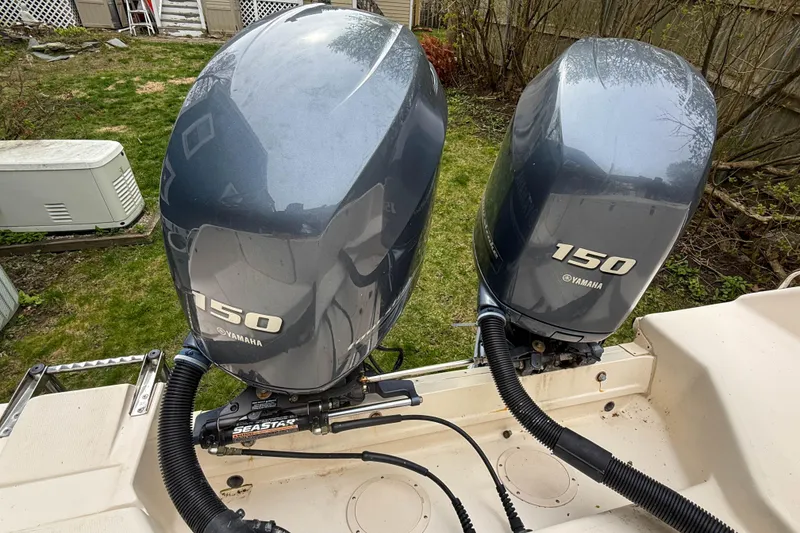 Slide: The Image of Twin Yamaha 150 engines on a 2015 Grady-White Freedom 275 boat. - 45