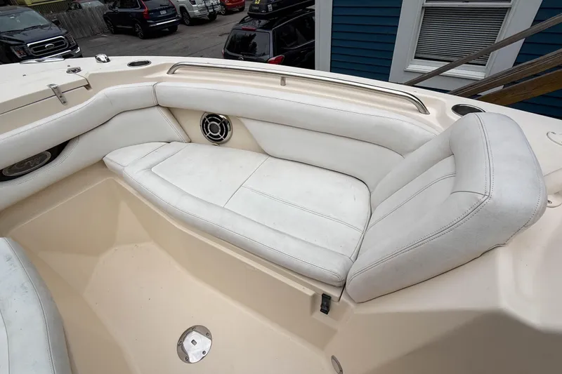 Slide: The Image of 2015 Grady-White Freedom 275 boat interior with white cushioned seating. - 28