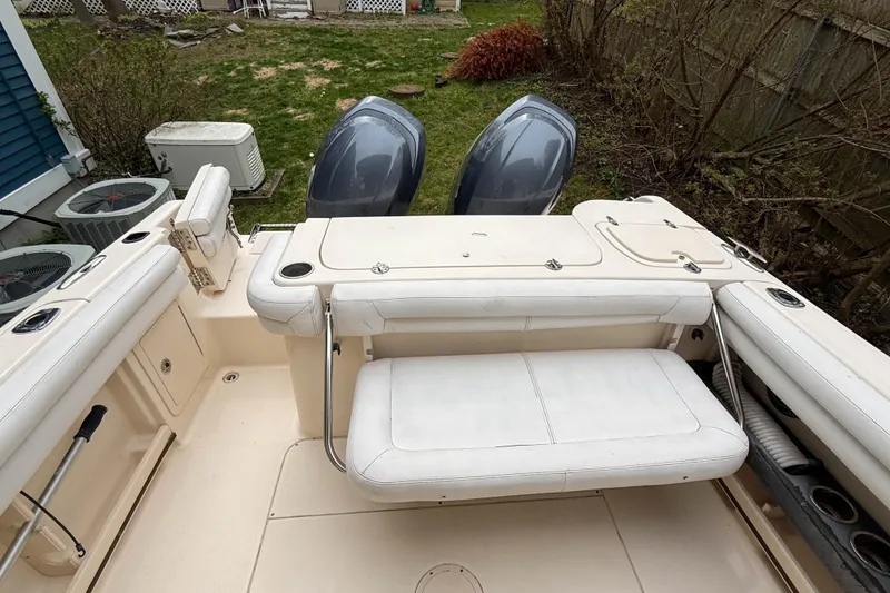 Slide: The Image of 2015 Grady-White Freedom 275 boat with dual engines and spacious seating area. - 35