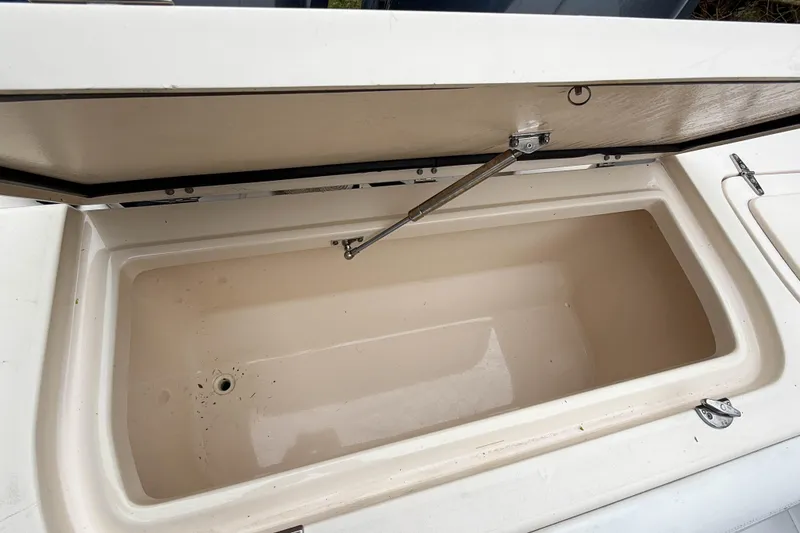 Slide: The Image of Open storage compartment on a 2015 Grady-White Freedom 275 boat. - 40