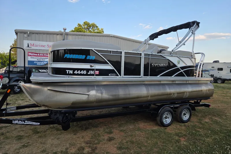 The Image of 2022 Sylvan Mirage 820 Cruise pontoon boat on trailer, parked outdoors. - 0
