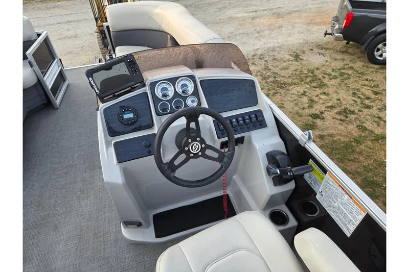 Slide: The Image of Cockpit of 2022 Sylvan Mirage 820 Cruise pontoon boat with steering wheel and control panel. - 11