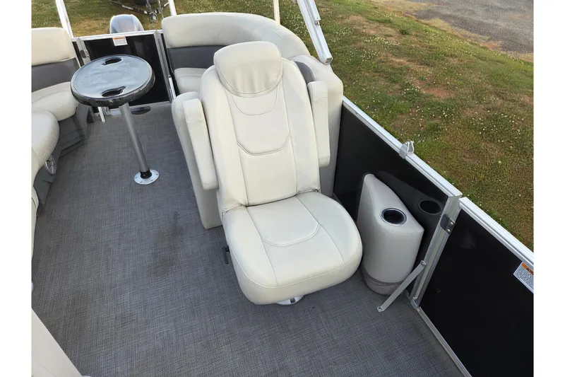 Slide: The Image of 2022 Sylvan Mirage 820 Cruise interior with plush seating and table. - 16