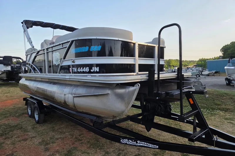 Slide: The Image of 2022 Sylvan Mirage 820 Cruise pontoon boat on trailer in outdoor setting. - 2