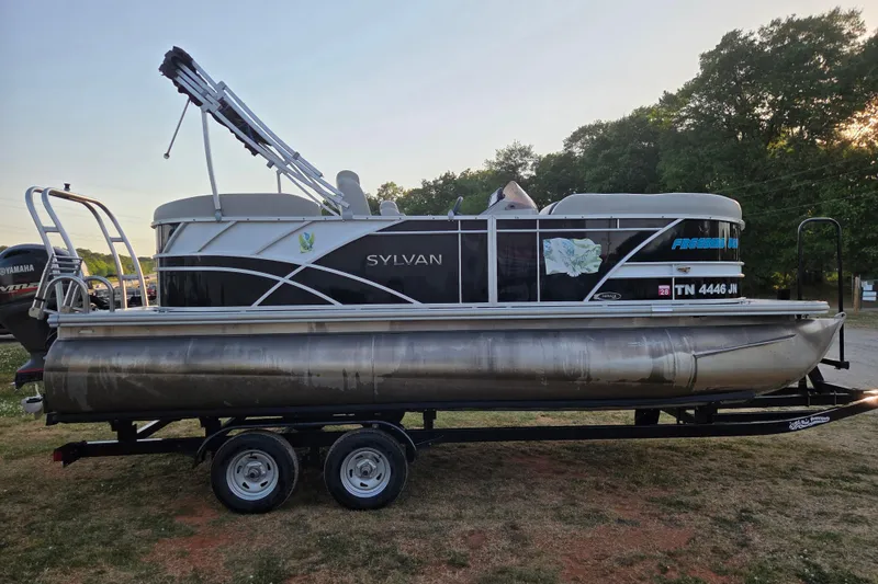 Slide: The Image of 2022 Sylvan Mirage 820 Cruise pontoon boat on trailer, parked outdoors. - 3