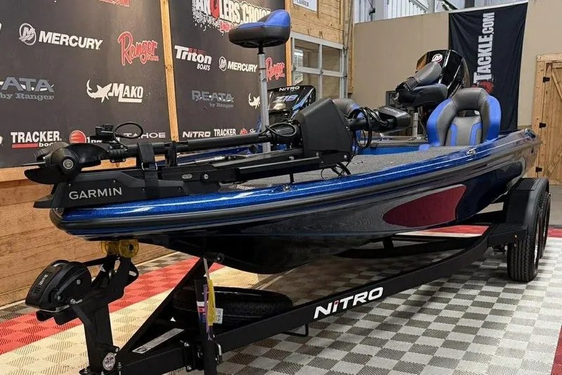 Slide: The Image of 2026 Nitro Z18 Pro fishing boat with Garmin equipment on display in showroom. - 3