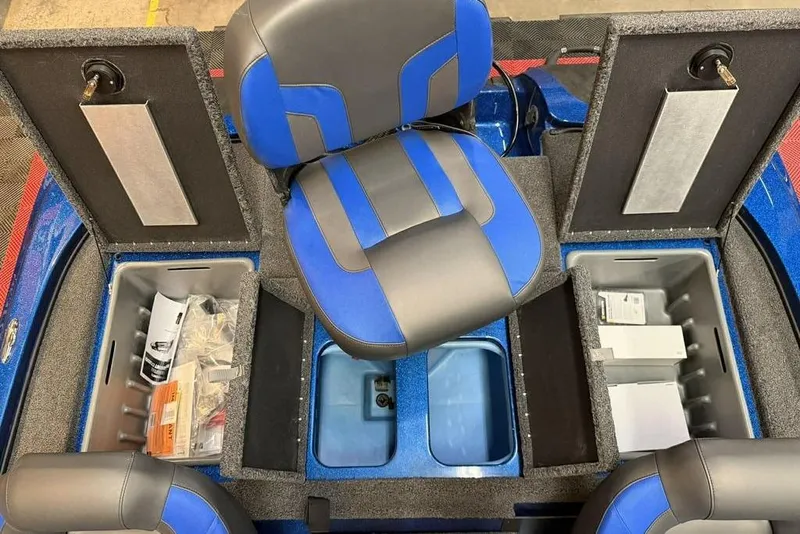 Slide: The Image of 2026 Nitro Z18 Pro boat interior with blue seats and storage compartments open. - 6