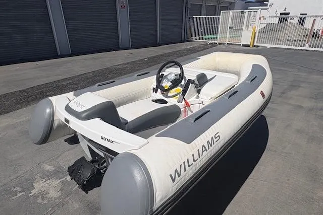 The Image of 2017 Williams 280 Mini Jet boat with Rotax engine, parked outdoors. - 1