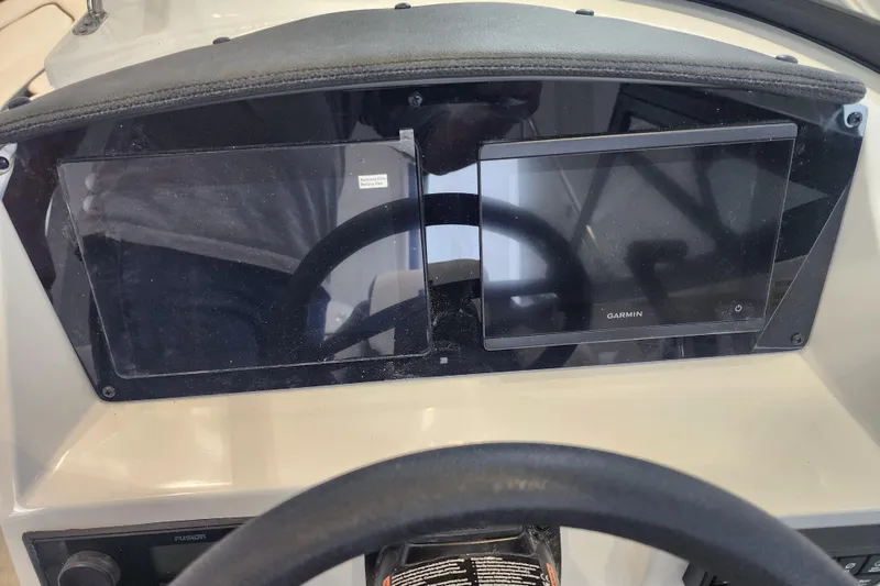 Slide: The Image of Dashboard of 2026 Stingray 211 DC boat with Garmin display. - 46