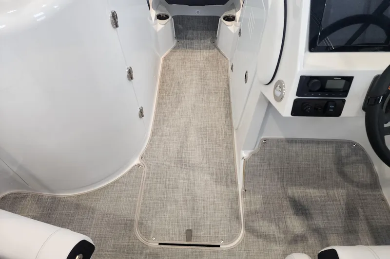 Slide: The Image of Interior view of 2026 Stingray 211 DC boat, featuring sleek design and modern controls. - 49