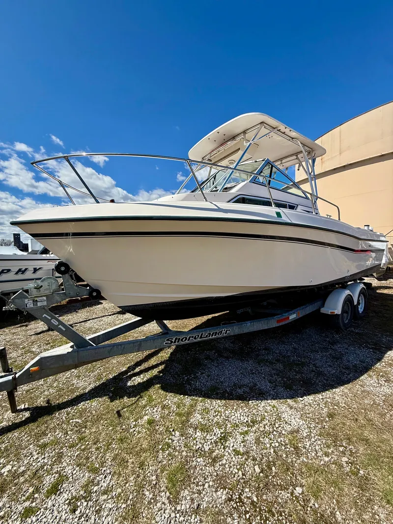 Slide: The Image of 1996 Grady-White Gulfstream 232 boat on trailer under sunny skies. - 7