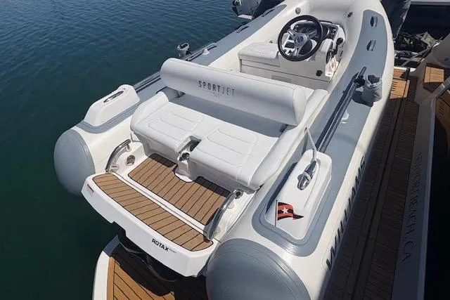 Slide: The Image of 2024 Williams Jet Tenders Sportjet 345, sleek design, luxury seating, on calm water. - 3