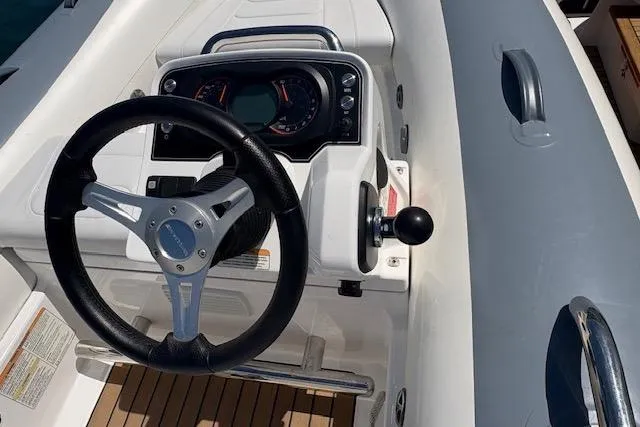 Slide: The Image of 2024 Williams Jet Tenders Sportjet 345 dashboard with steering wheel and controls. - 4