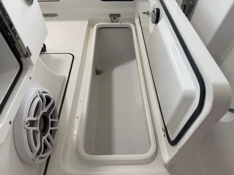 Slide: The Image of Open storage compartment in Sportsman Heritage 261 Center Console 2026. - 13