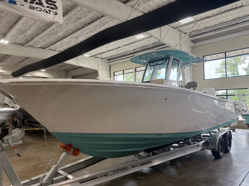 Slide: The Image of 2026 Sportsman Heritage 261 Center Console in showroom. - 15