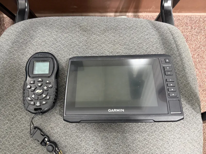 Slide: The Image of Garmin device and i-Pilot remote on a chair. - 7