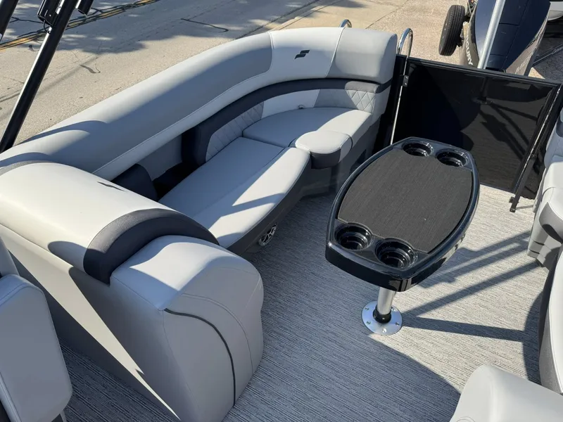 Slide: The Image of Interior of 2026 Starcraft EXS 5 R DH with gray seating and table. - 12