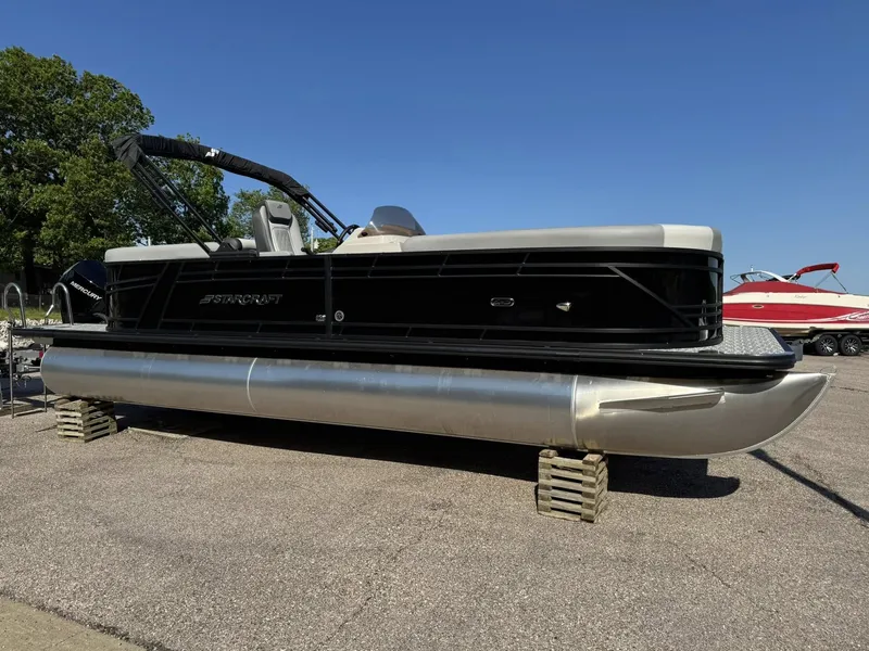 Slide: The Image of 2026 Starcraft EXS 5 R DH pontoon boat on a parking lot. - 4