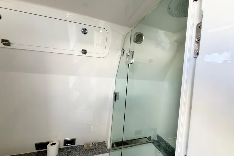 Slide: The Image of Interior of 2019 HCB 53 Suenos yacht bathroom with glass shower door. - 13