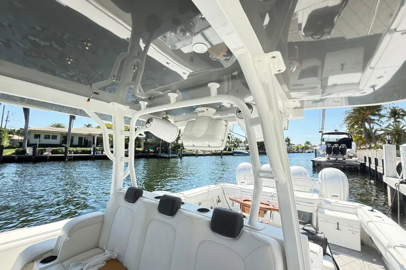 Slide: The Image of 2019 HCB 53 Suenos boat interior with seating, docked by a waterfront. - 21