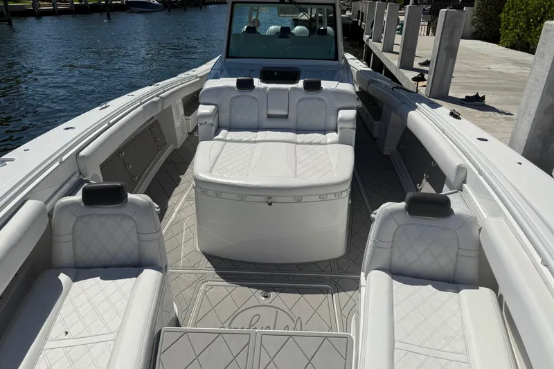 Slide: The Image of Luxurious 2019 HCB 53 Suenos boat interior with elegant white seating and spacious layout. - 23