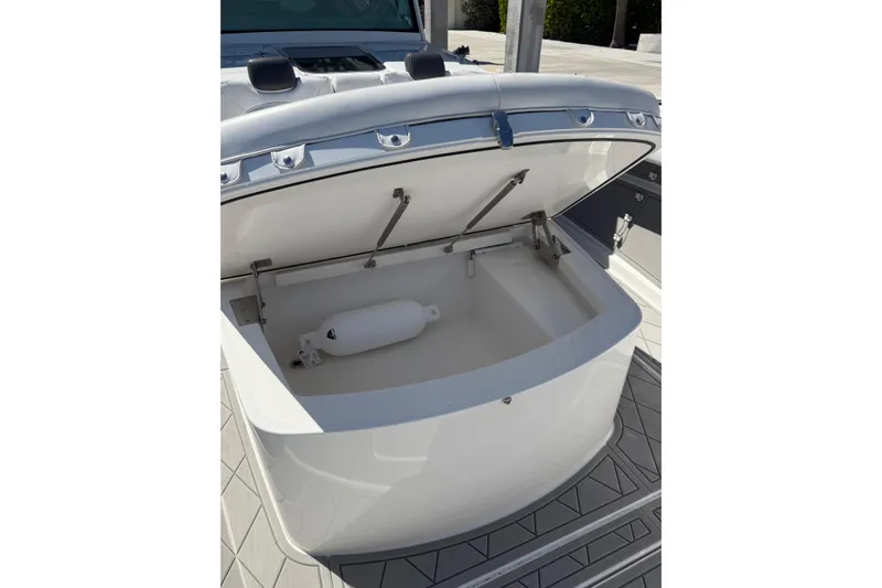 Slide: The Image of Open storage compartment on 2019 HCB 53 Suenos boat, showcasing interior space. - 26