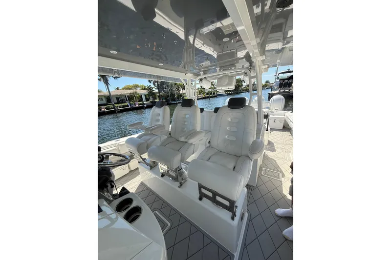 Slide: The Image of Luxurious seating on a 2019 HCB 53 Suenos boat, featuring sleek white upholstery. - 30