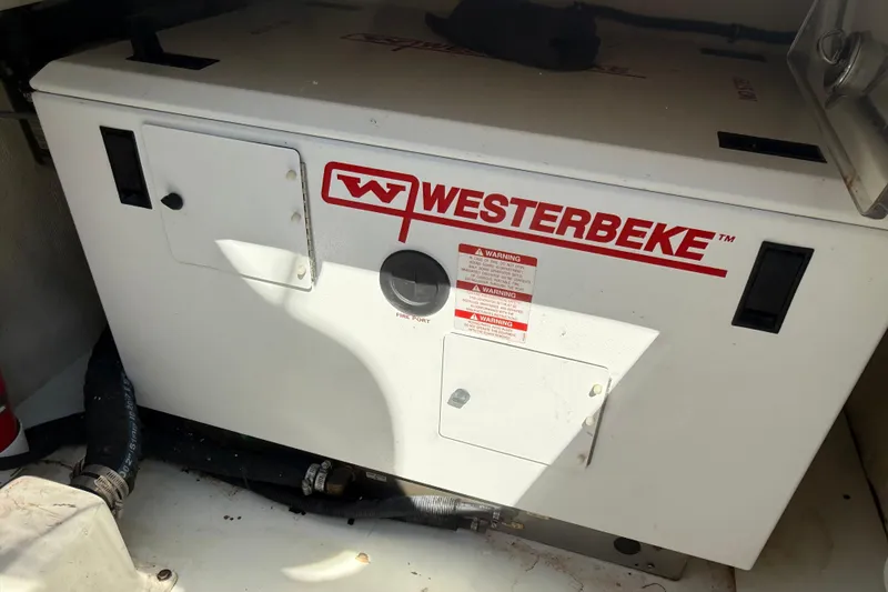 Slide: The Image of Westerbeke generator inside a 2019 HCB 53 Suenos boat engine compartment. - 38