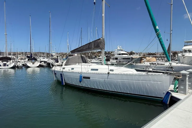 The Image of Sailboat Beneteau Oceanis 361, 2001 model, docked in a marina under clear blue skies. - 0