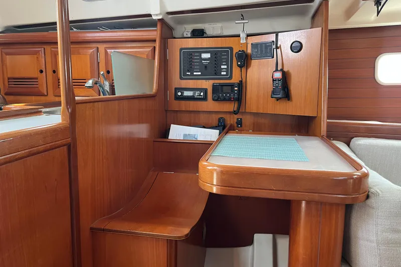 Slide: The Image of Cozy cabin interior of 2001 Beneteau Oceanis 361 with blue bedding. - 19