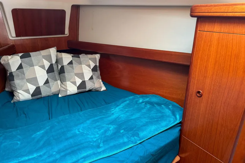 Slide: The Image of Engine compartment of a 2001 Beneteau Oceanis 361 sailboat, showcasing mechanical components. - 25