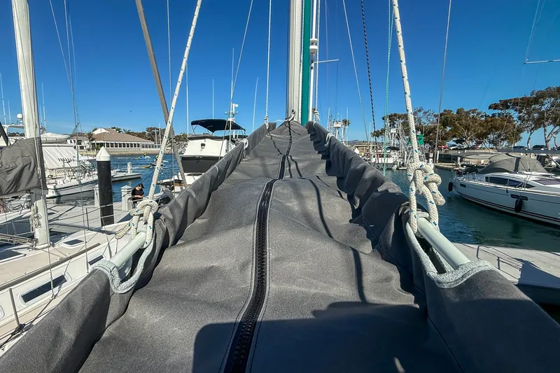 Slide: The Image of Beneteau Oceanis 361 sailboat cockpit with canopy, docked in marina, 2001 model. - 30