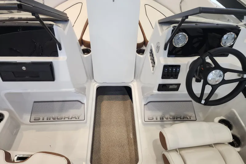 Slide: The Image of 2026 Stingray 172 DC boat interior with steering wheel and dashboard controls. - 11