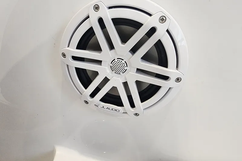 Slide: The Image of White JL Audio speaker on a 2026 Stingray 172 DC boat. - 14