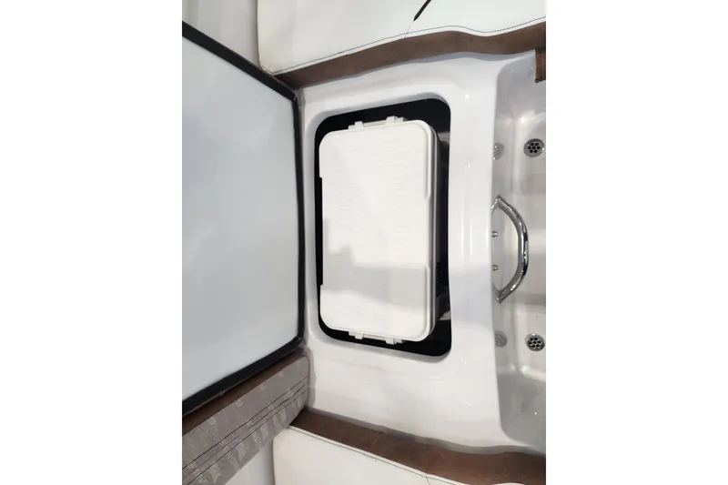 Slide: The Image of 2026 Stingray 172 DC boat interior with storage compartment and handle. - 16