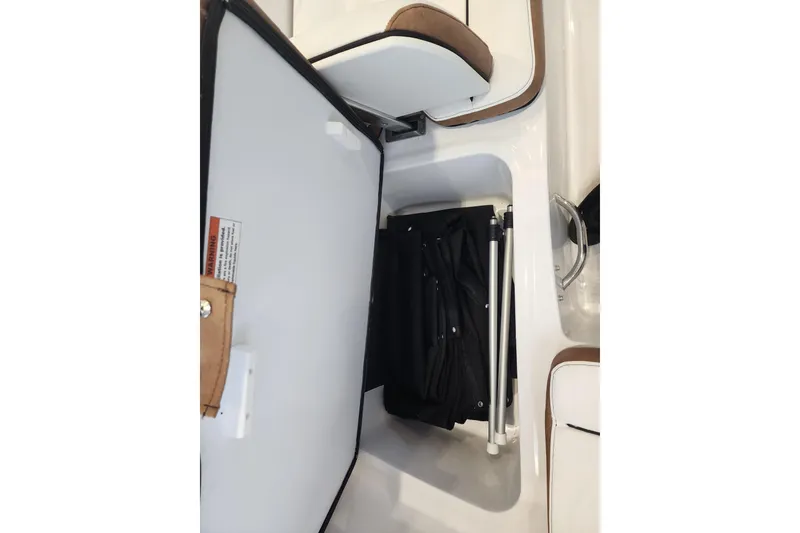 Slide: The Image of Storage compartment in 2026 Stingray 172 DC boat, featuring organized interior space. - 17