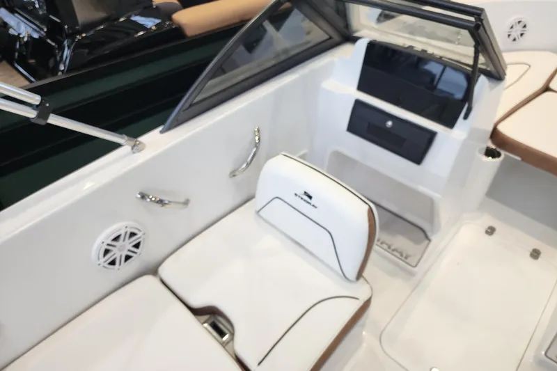 Slide: The Image of Interior of 2026 Stingray 172 DC boat with white seating and dashboard. - 19