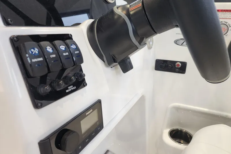 Slide: The Image of 2026 Stingray 172 DC boat dashboard with control panel and steering wheel. - 22