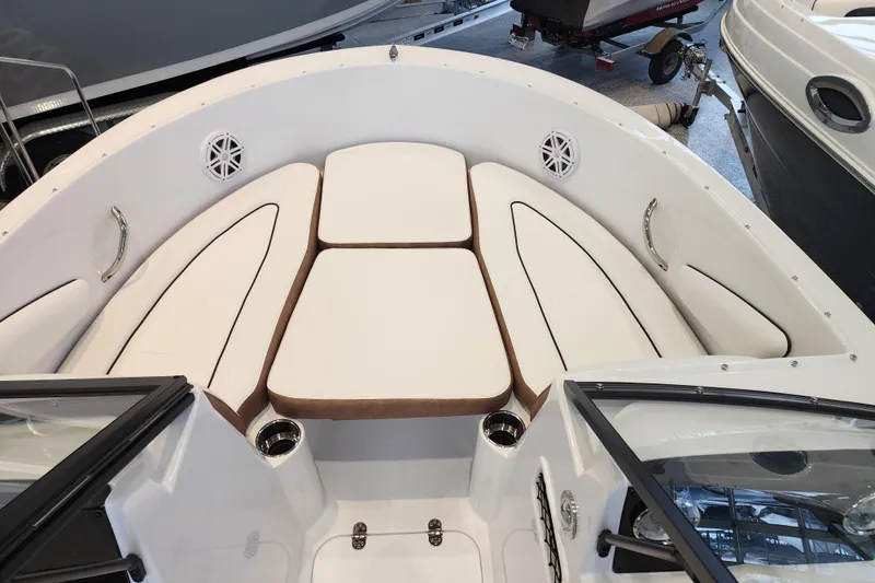 Slide: The Image of 2026 Stingray 172 DC boat interior with white cushioned seating and stainless steel accents. - 25