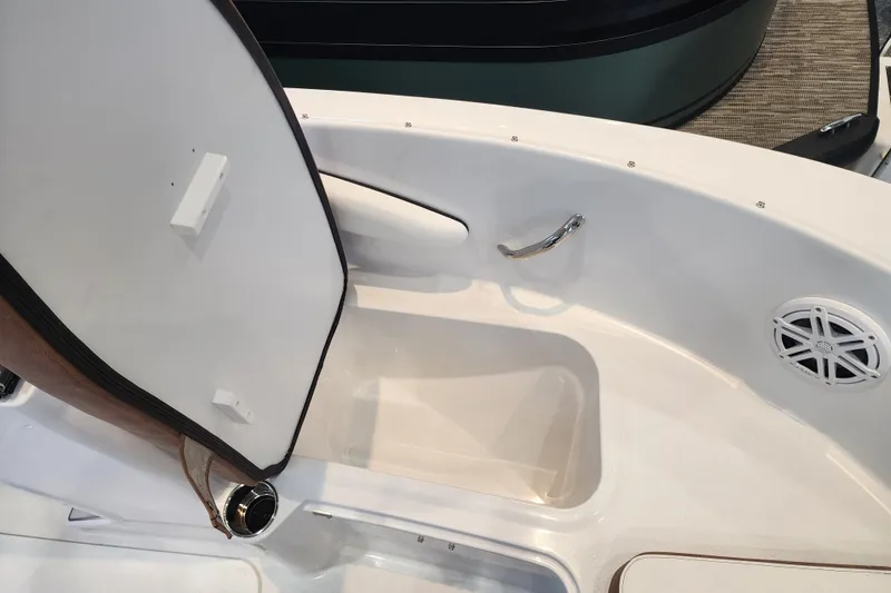 Slide: The Image of 2026 Stingray 172 DC boat interior with open storage compartment and speaker. - 31
