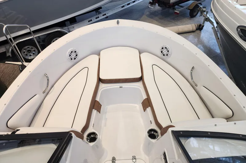 Slide: The Image of 2026 Stingray 172 DC boat interior with white cushioned seating and stainless steel accents. - 32