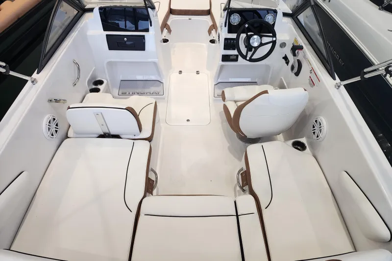 Slide: The Image of 2026 Stingray 172 DC boat interior with white seating and modern dashboard. - 33