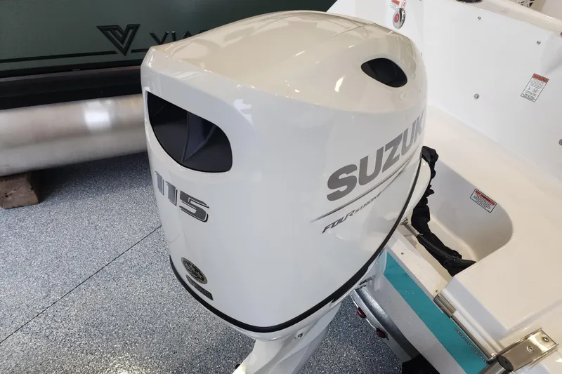 Slide: The Image of 2026 Stingray 172 DC with Suzuki 115 outboard motor in showroom. - 34