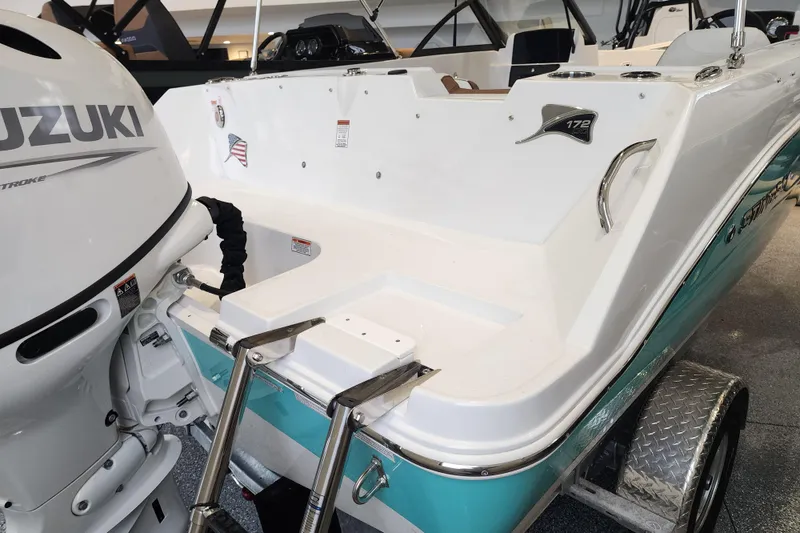 Slide: The Image of 2026 Stingray 172 DC boat with Suzuki outboard motor, displayed on a trailer. - 6