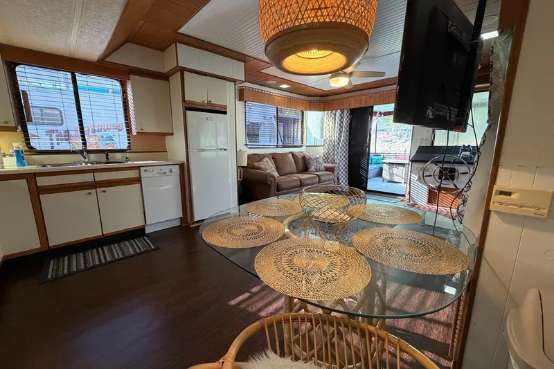 Slide: The Image of Interior of a 1989 Sumerset 14x63 houseboat with cozy living area and kitchen. - 11