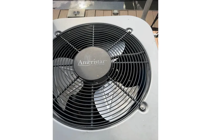 Slide: The Image of Ameristar air conditioning unit on a 1989 Sumerset 14x63 houseboat deck. - 27